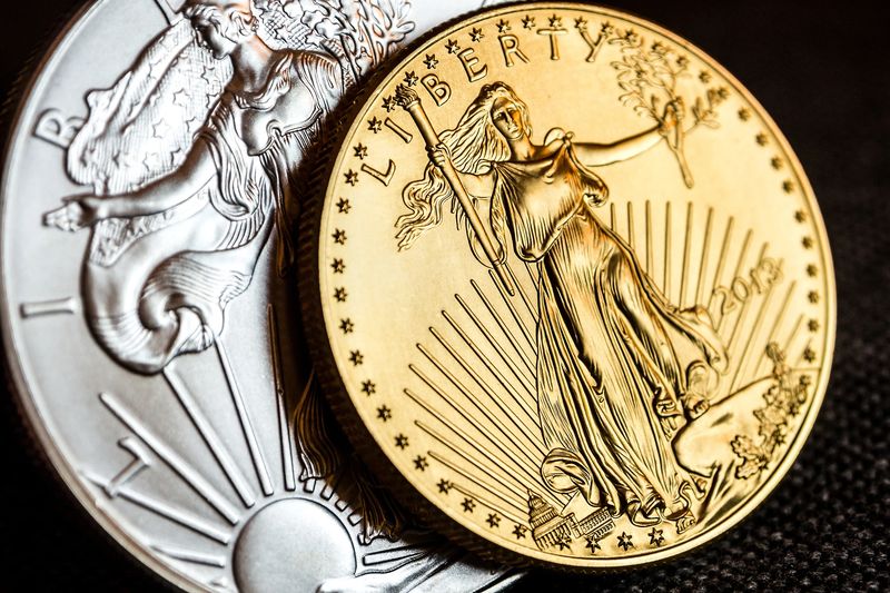Close view of a Gold Eagle and a Silver Eagle, the kind of Mint coins Denver collectors keep in their original boxes
